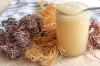 a jar of seaweed with a spoon next to it